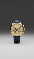 Gold chronograph watch with polished bezel